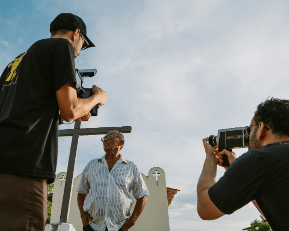 Branded t shirts being worn by a film production crew