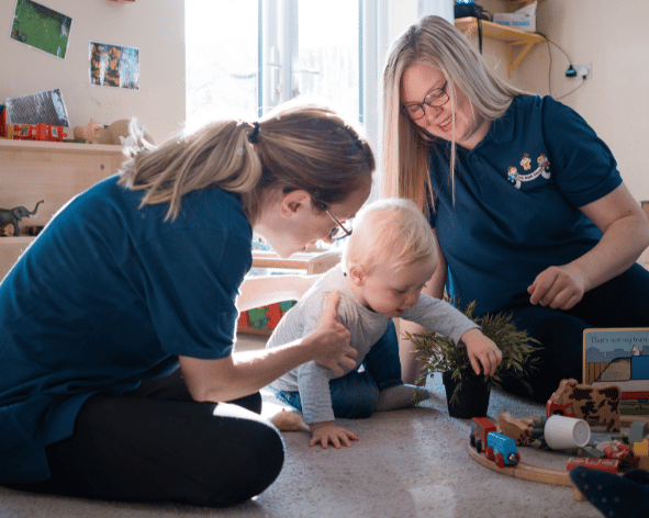 EMbroidered polo shirts being used in a nursery setting